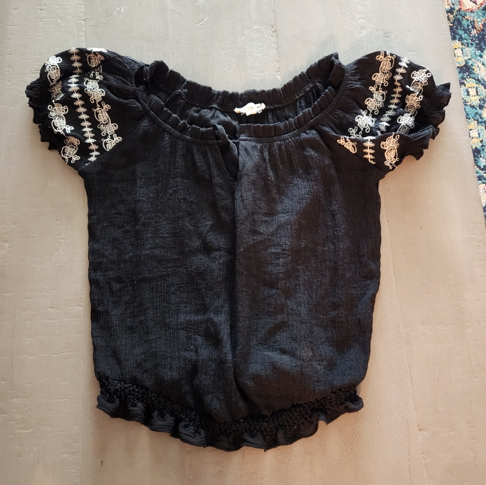 Blouse, E&M size small black with white detail on the cap sleeves.